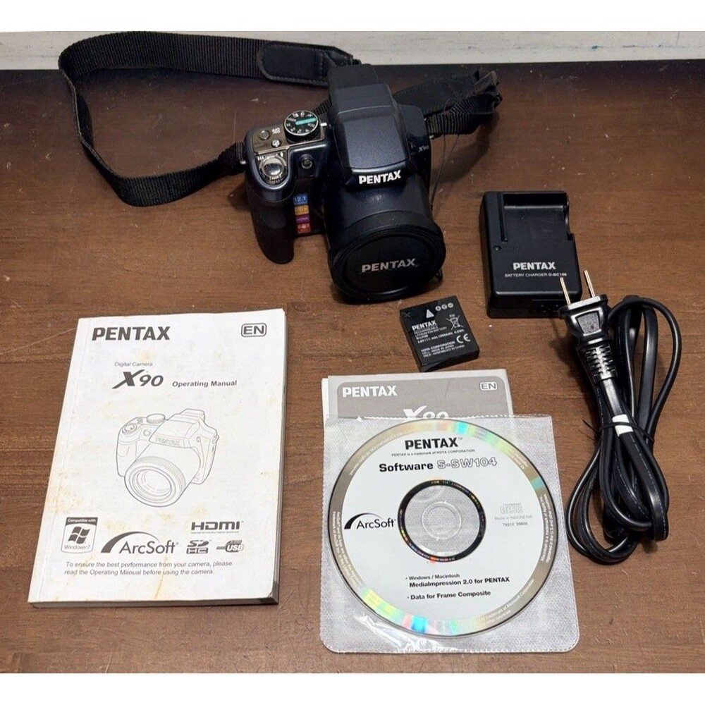 Pentax X90 12.1MP Digital Bridging Camera w/manual, Battery, Charger & Strap